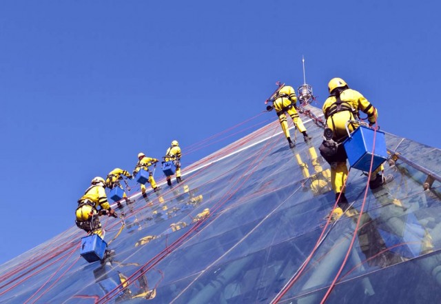 PHOTOS: Cleaning crew climb Raffles Dubai hotel